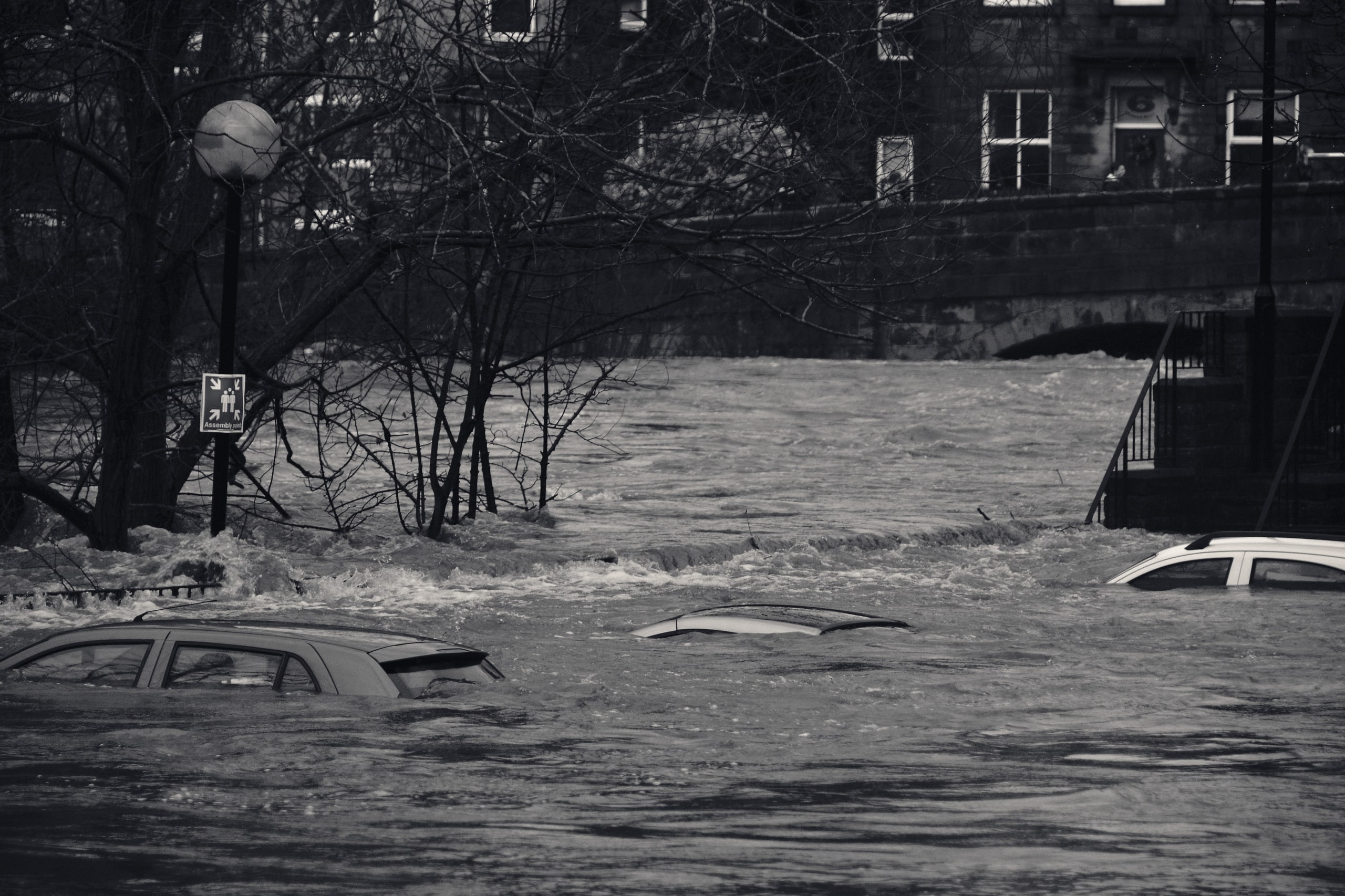 Flooded street with partly submerged cars