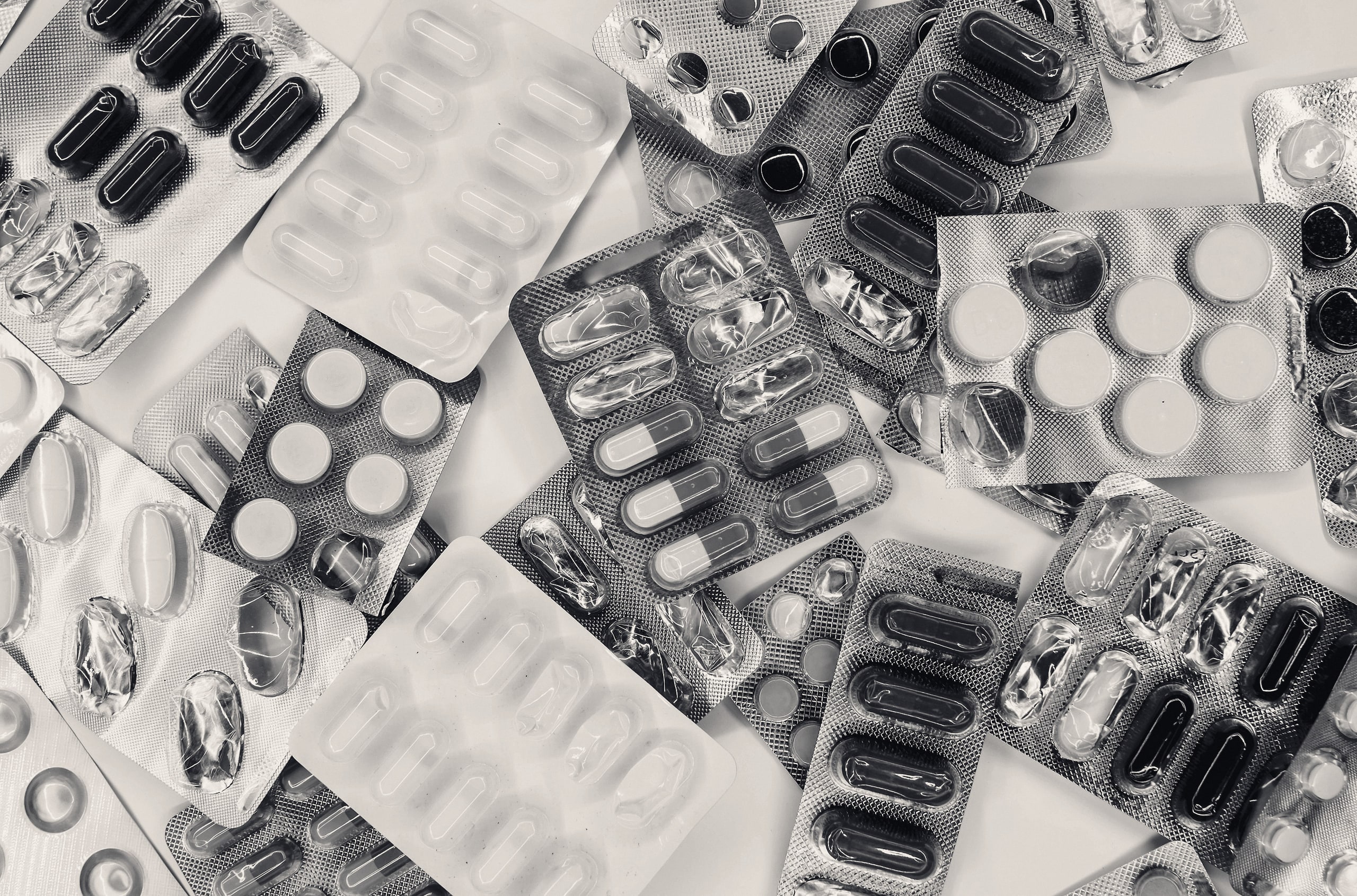 Assorted medication blister packs on a table