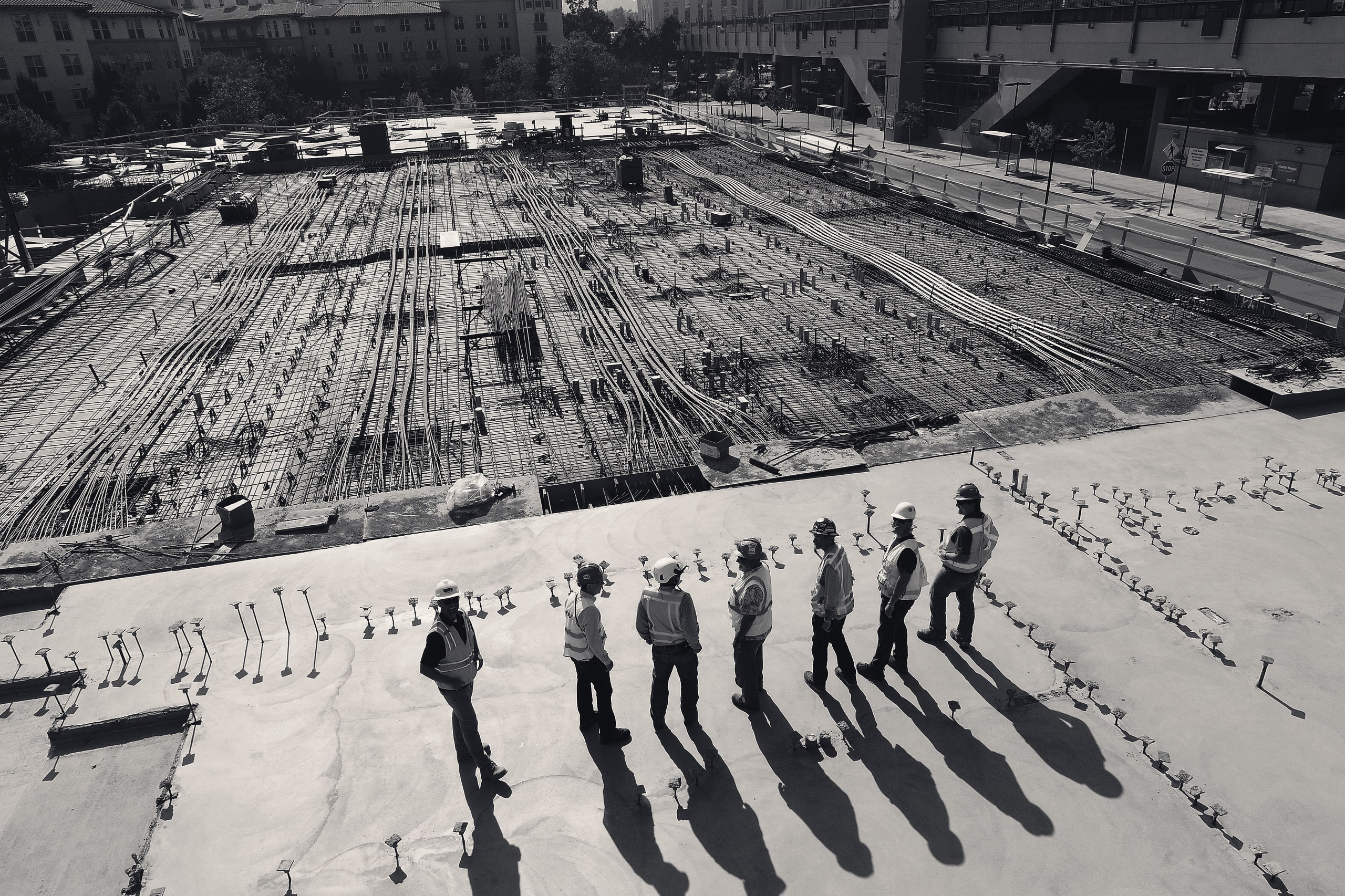 Construction workers in safety gear on a building site